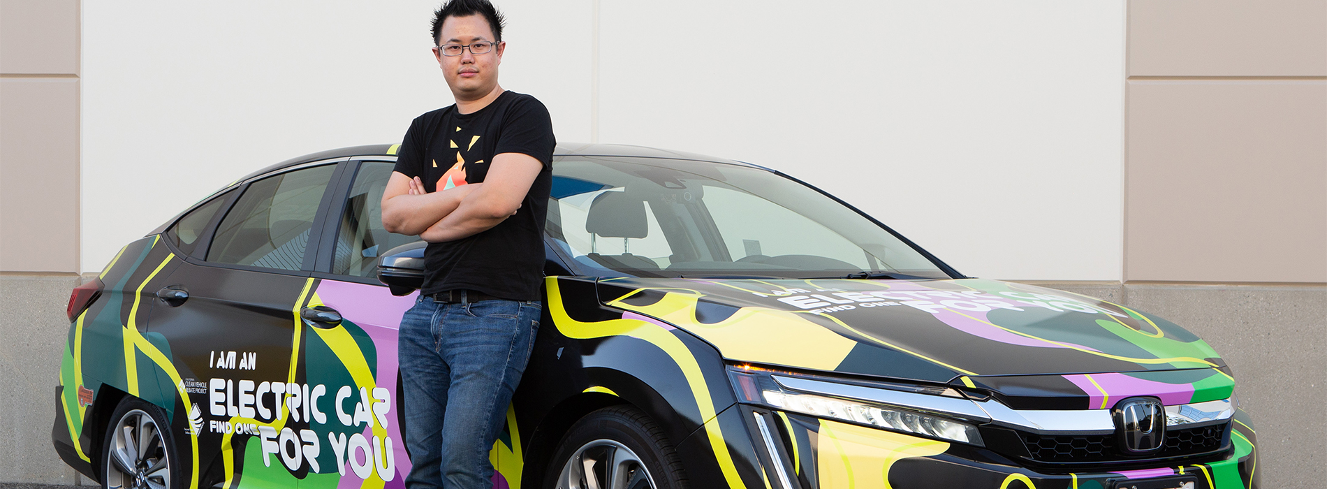 Kelvin Liu standing next to his newly wrapped plug-in hybrid Honda Clarity