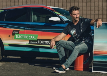 Electric vehicle being wrapped with artistic design.