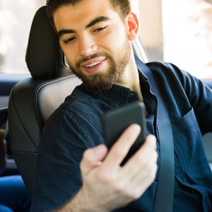 image of a rideshare driver and passenger